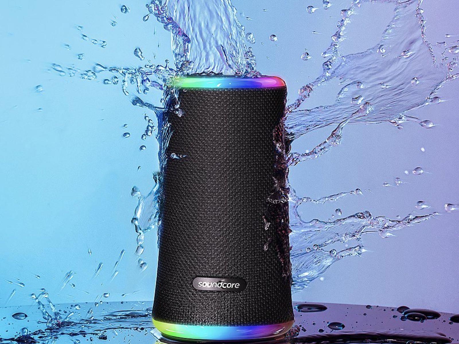 Image shows the Soundcore by Anker Flare 2 Bluetooth Speaker with water splashes surrounding it