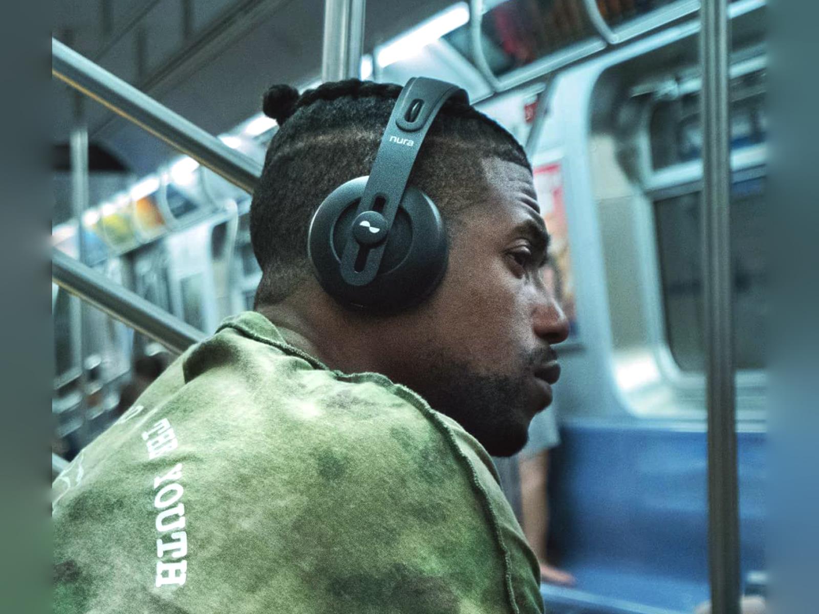 Nuraphones Used By Man While Listening To Music On A Train