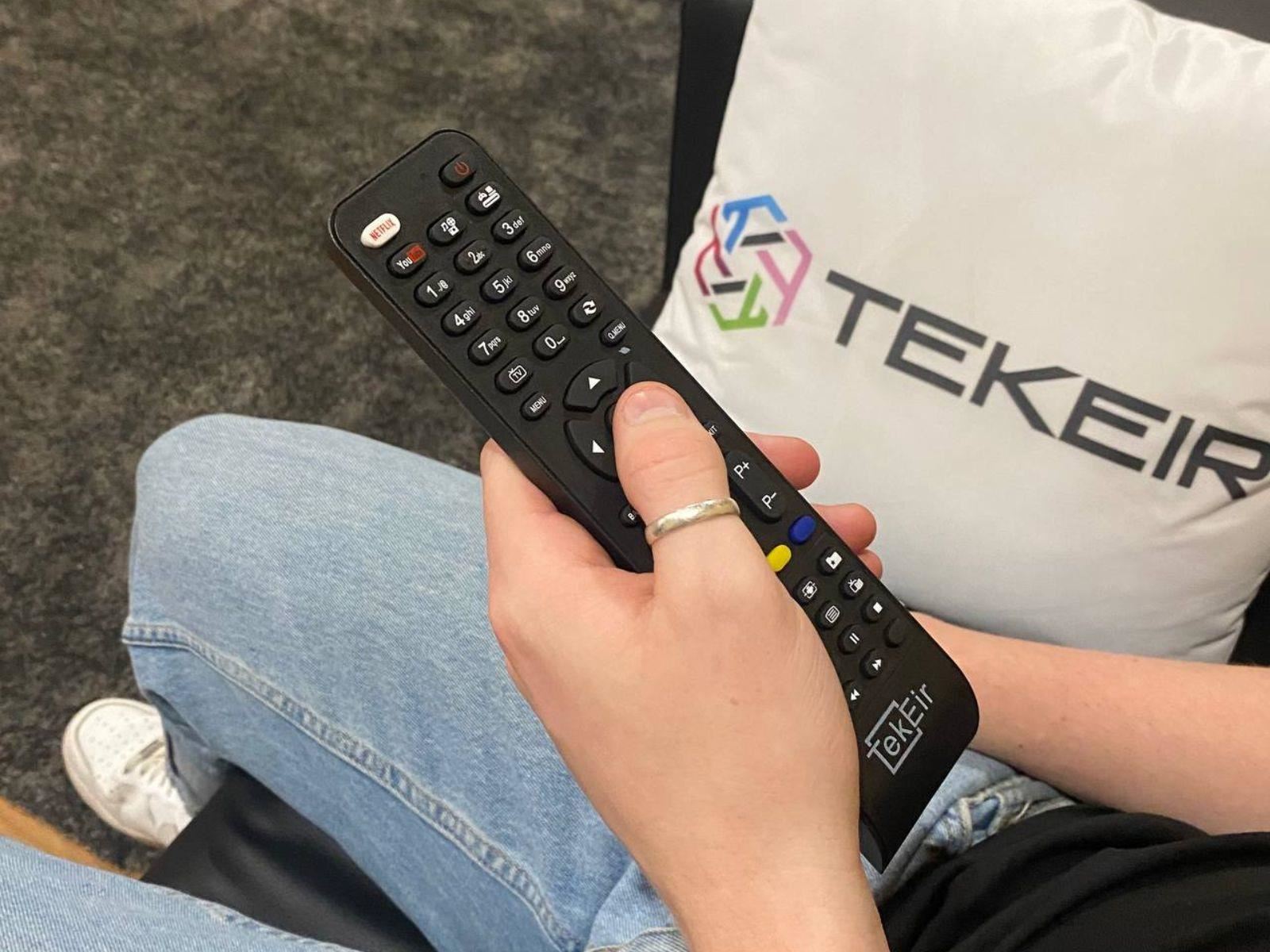 Image shows someone holding the replacement remote control