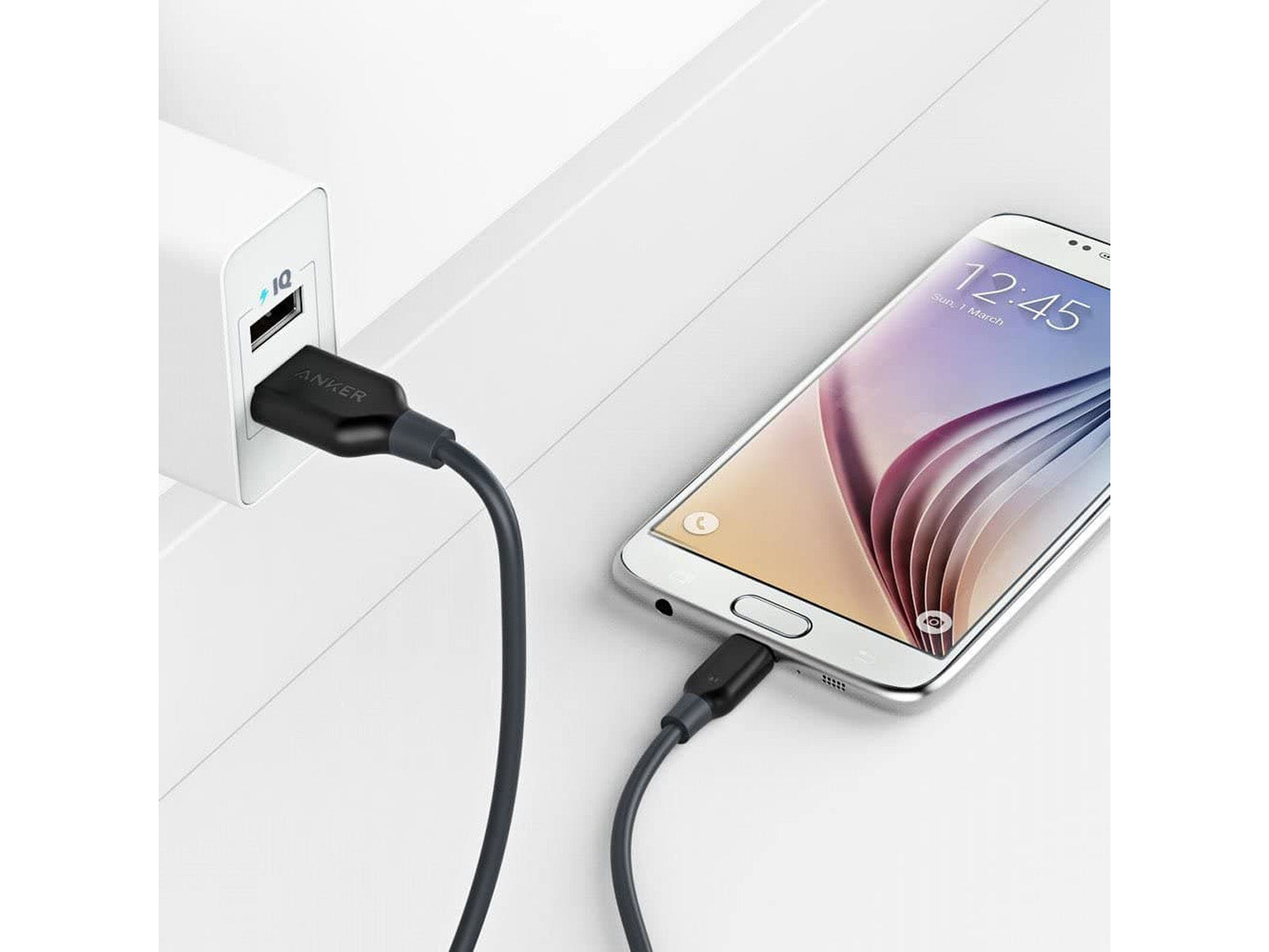 Image shows a phone charging using the PowerLine Select Micro USB High-Speed Charging Cable 